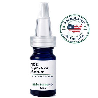 A 10mL bottle of Skin SurgeMD 10% Syn-Ake Serum with a white dropper cap and a white label, shown on a white background with a green circular 'Formulated in the USA' badge.