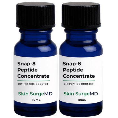 Two 10mL blue glass bottles of Skin SurgeMD Snap-8 Peptide Booster Concentrate with black caps and white labels, shown side by side on a white background.