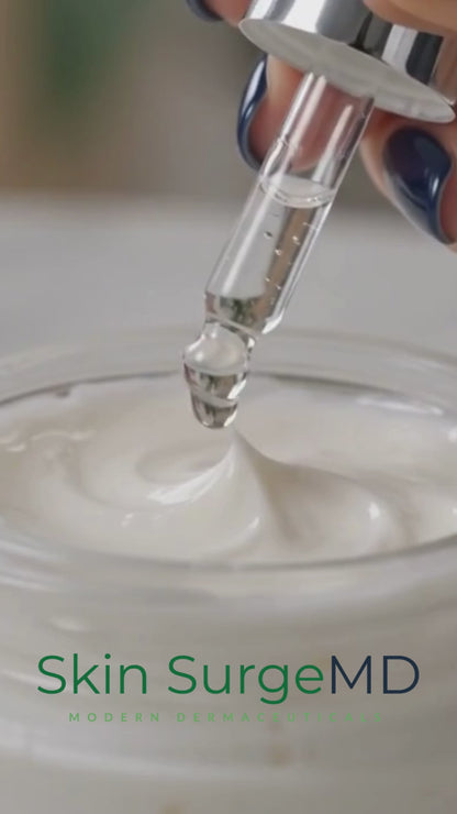 Close-up of Skin SurgeMD Snap-8 Peptide Concentrate being added to a white face cream with a dropper, demonstrating how to customize skincare with a concentrated anti-aging peptide booster.